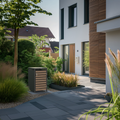 Ecoscape Single Bin Storage with Lid in Woodgrain and Charcoal in an outdoor setting