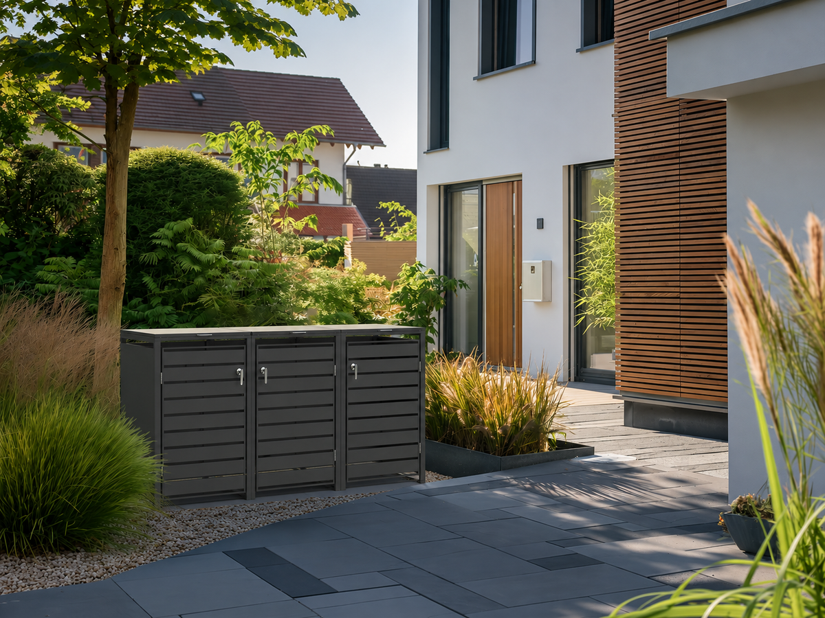 Ecoscape Triple Bin Storage with Lid in Charcoal in an outdoor setting